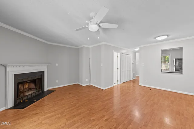wooden floor in an empty room with a window