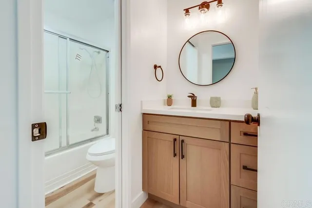 a bathroom with a shower and toilet