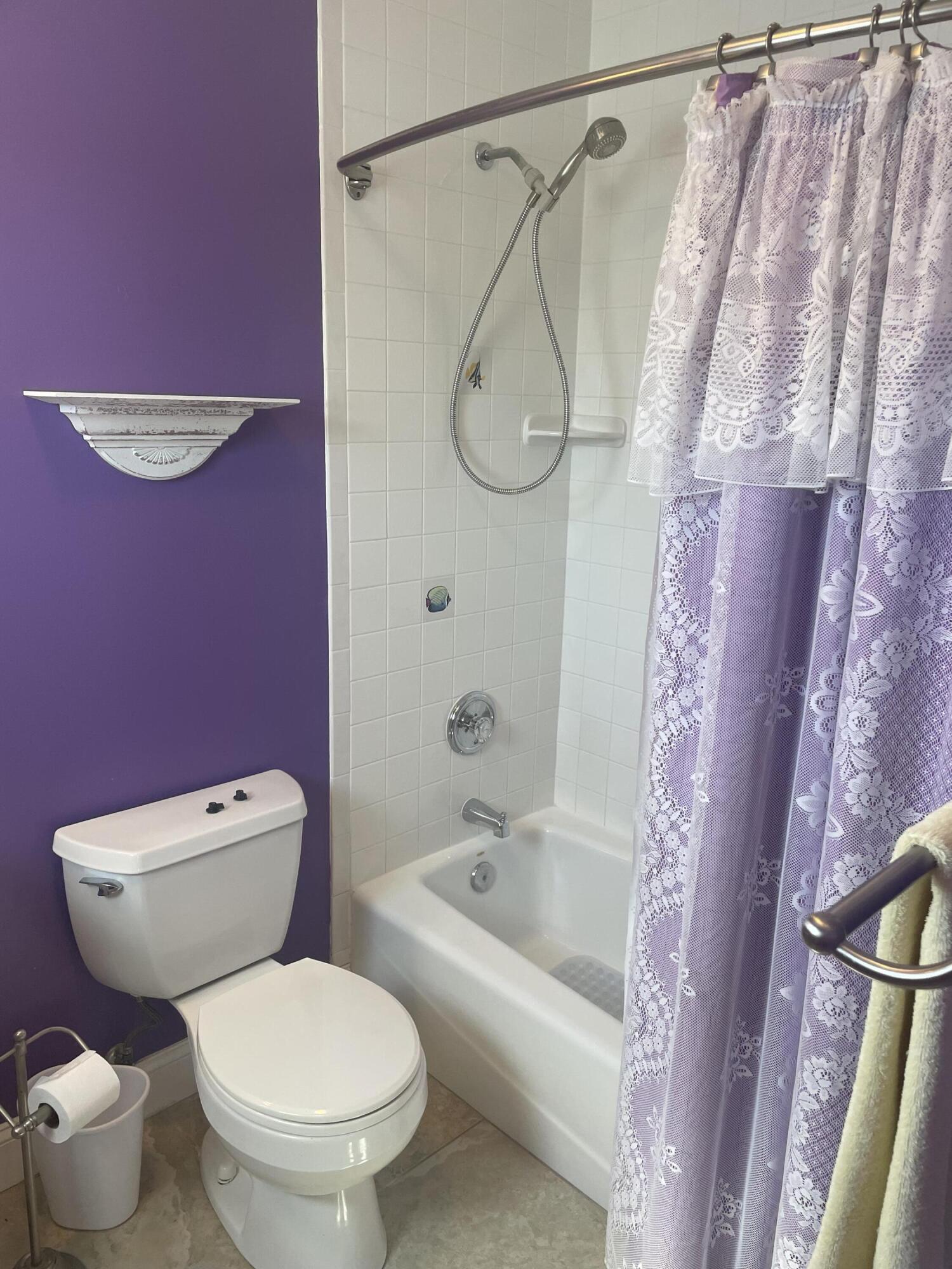 Undisclosed Address Big Pine Key, FL 33043 - Photo 13 of 28 a white toilet sitting next to a bath tub shower