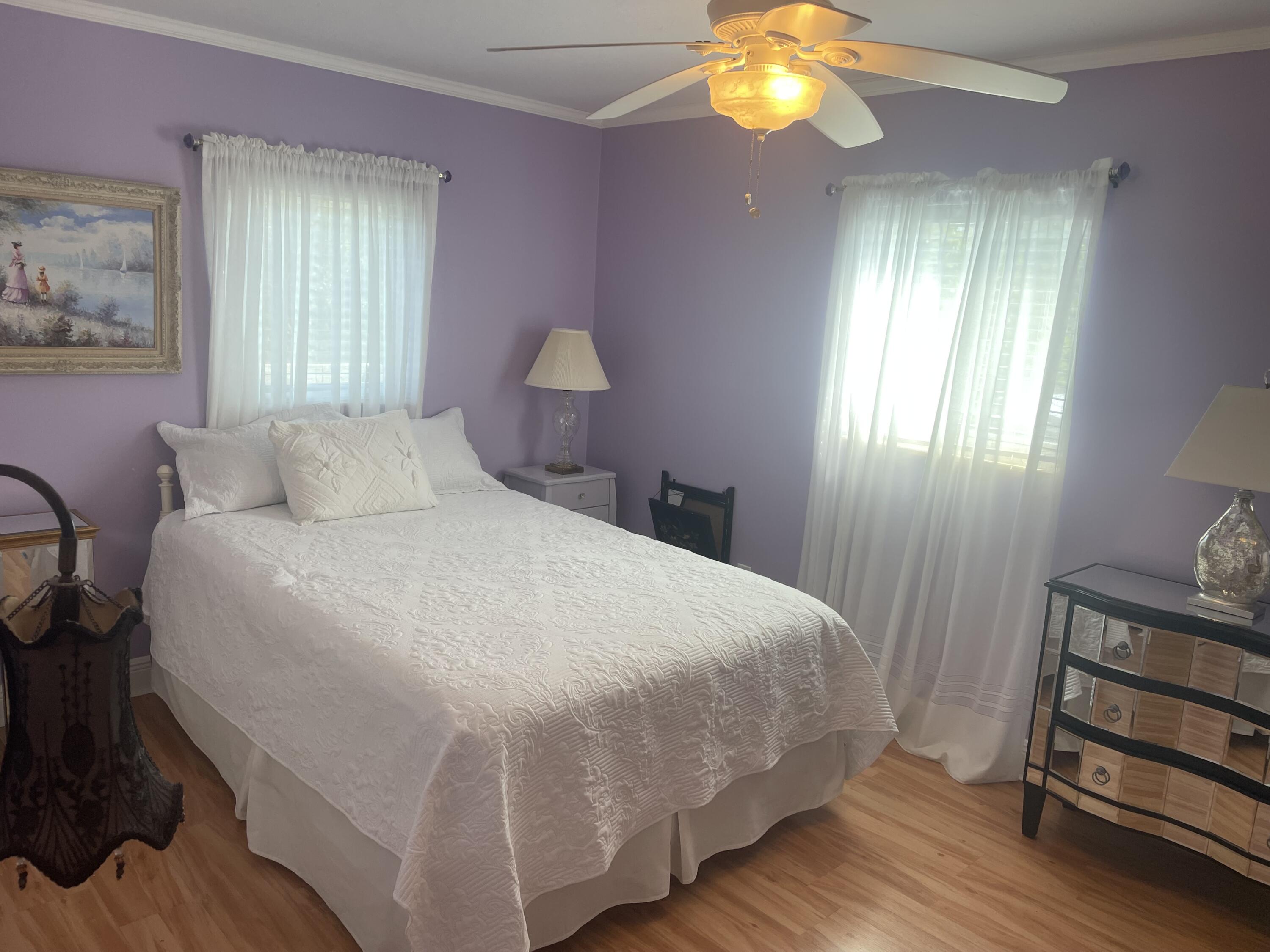 Undisclosed Address Big Pine Key, FL 33043 - Photo 15 of 28 a bedroom with a bed and a window