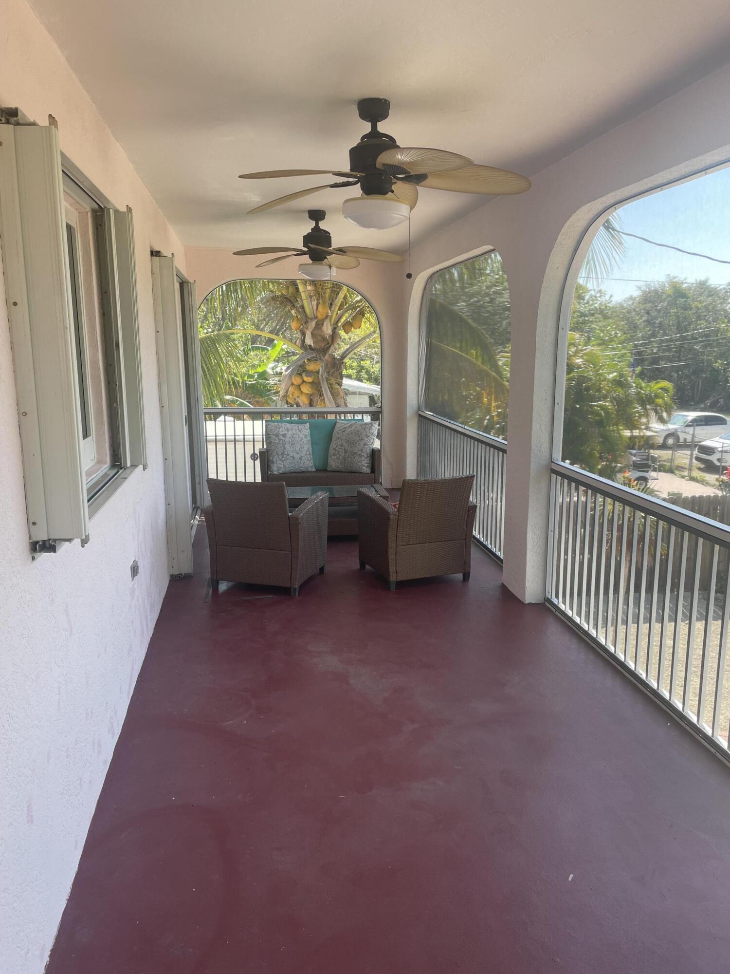 Undisclosed Address Big Pine Key, FL 33043 - Photo 18 of 28 a living room with furniture and a large window