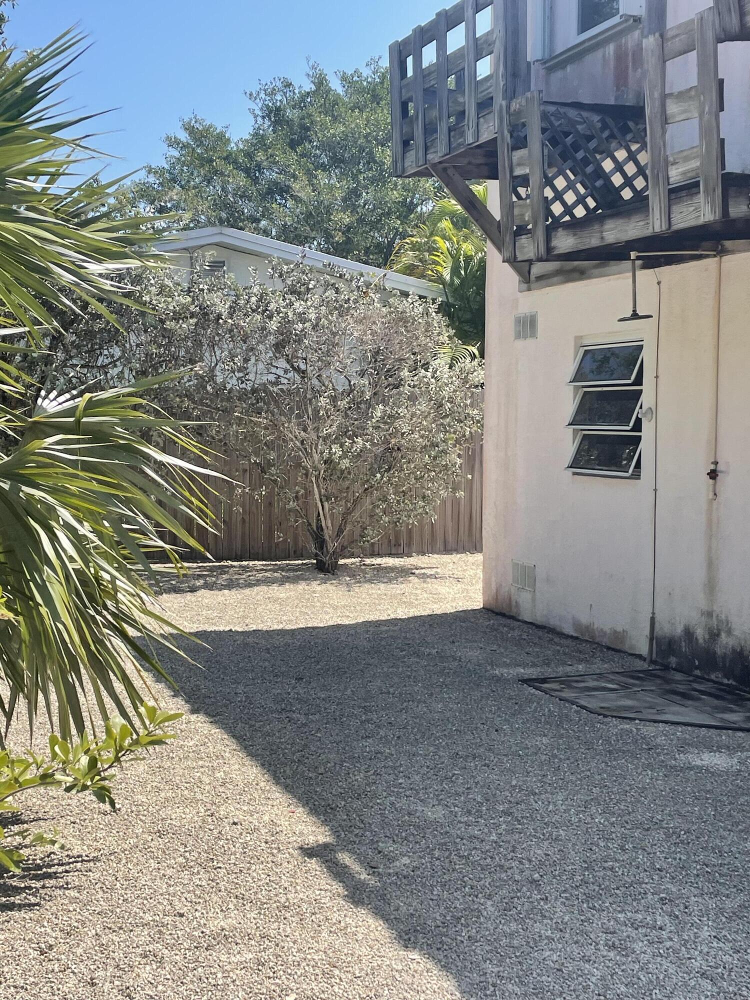 Undisclosed Address Big Pine Key, FL 33043 - Photo 21 of 28 a view of a entrance gate of the house