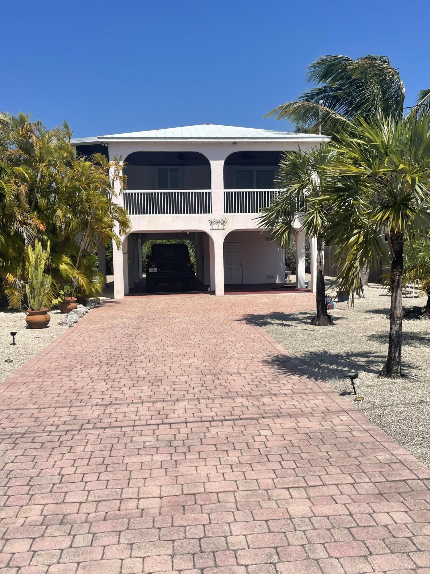 Undisclosed Address Big Pine Key, FL 33043 - Photo 28 of 28 a view of a building with a patio