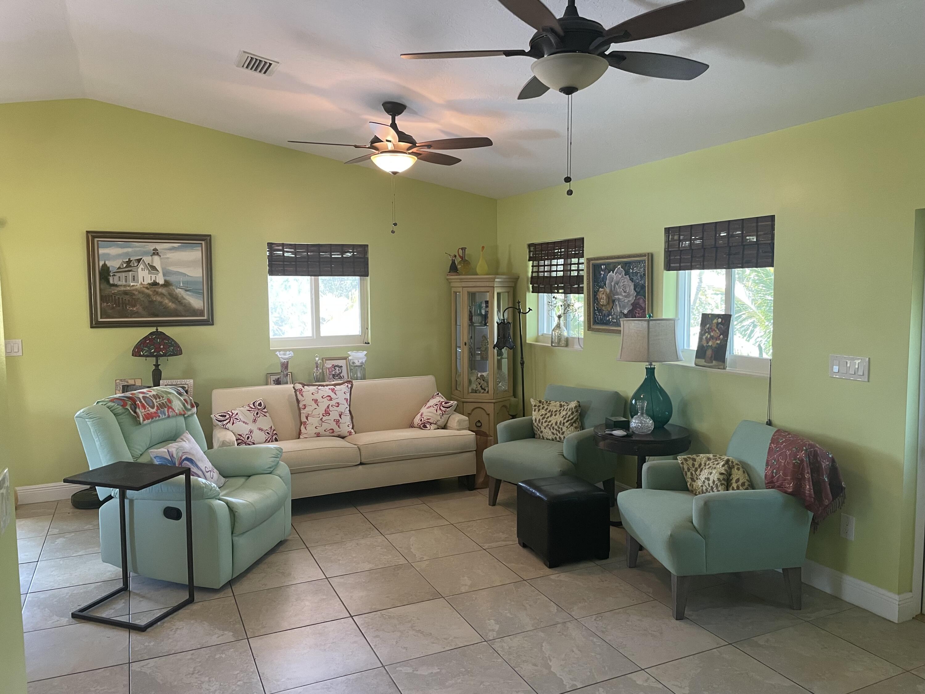 Undisclosed Address Big Pine Key, FL 33043 - Photo 5 of 28 a living room with furniture and a chandelier