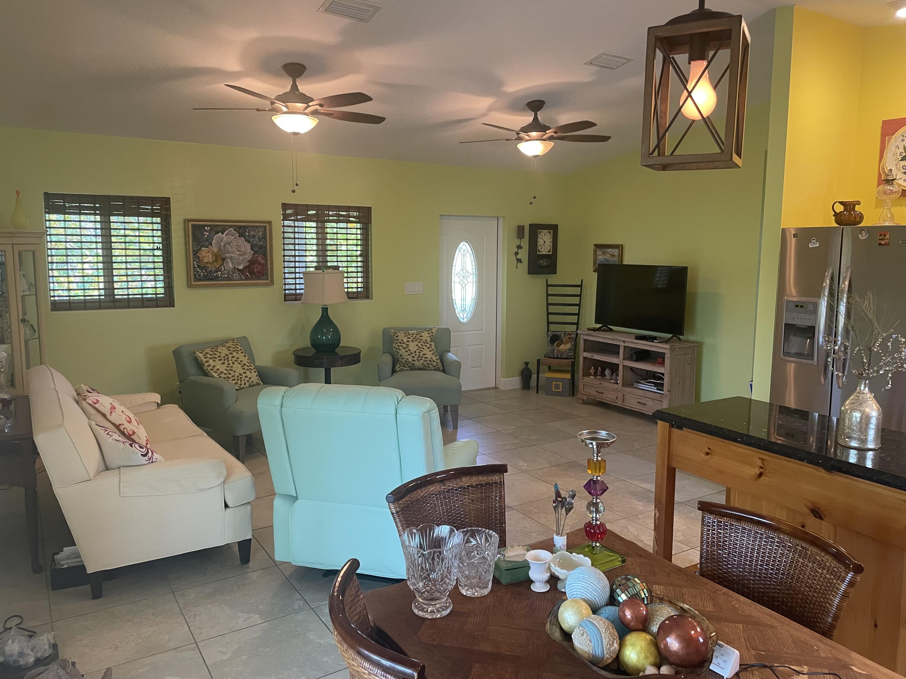 Undisclosed Address Big Pine Key, FL 33043 - Photo 6 of 28 a living room with furniture and a flat screen tv