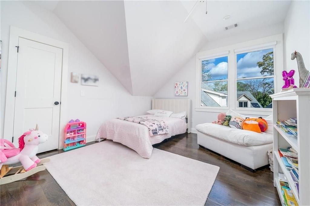 216 Haralson Lane Atlanta, GA 30307 - Photo 20 of 33 a bedroom with furniture and a potted plant