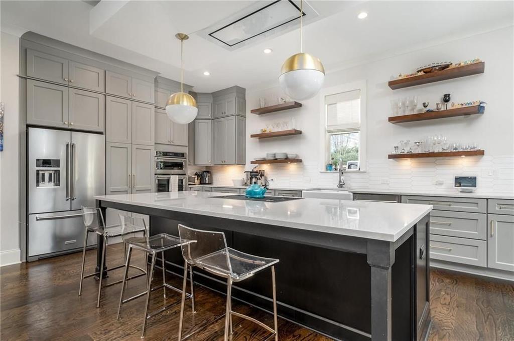 216 Haralson Lane Atlanta, GA 30307 - Photo 3 of 33 a kitchen with a sink stainless steel appliances and cabinets