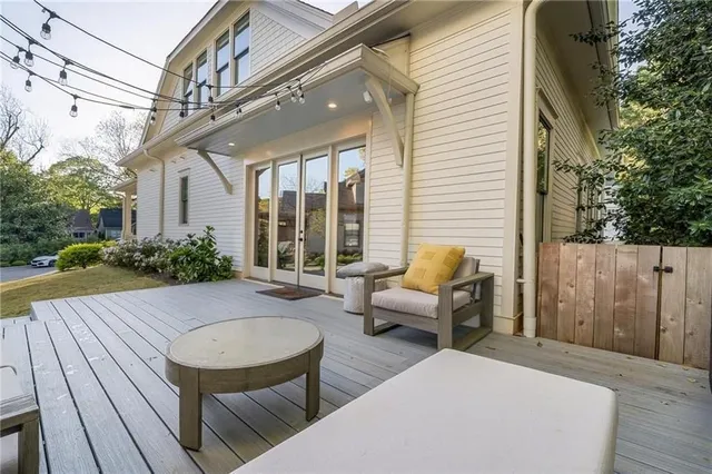 a view of a house with backyard and sitting area