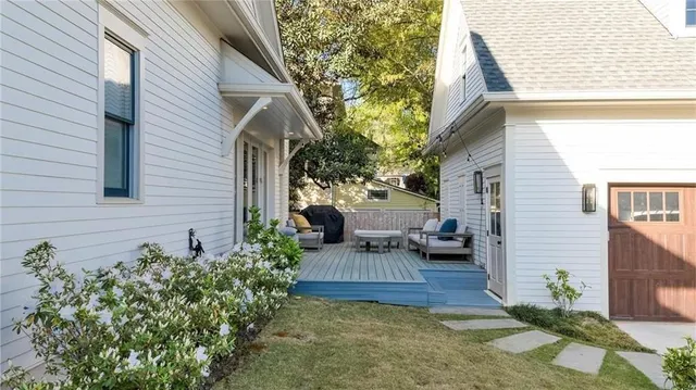 a view of a patio with couches and potted plants