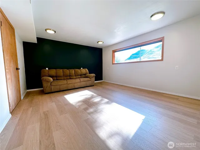 a view of livingroom with furniture and a window