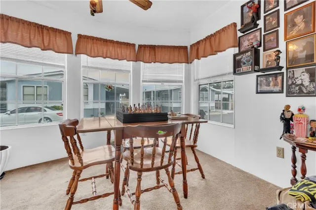 a dining room with furniture and window
