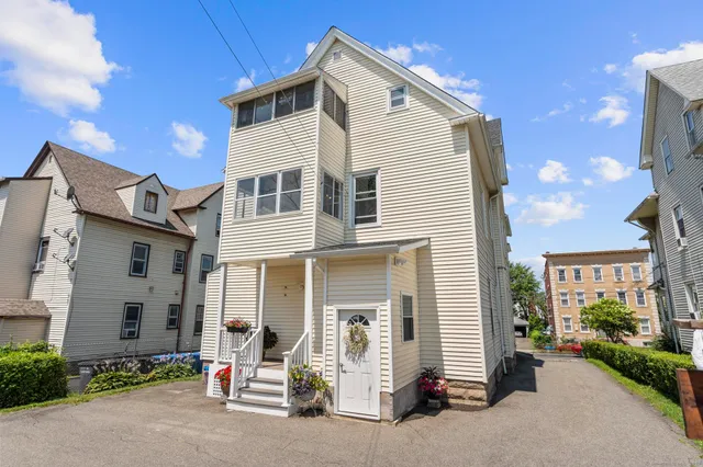 a view of a street with cars on the road