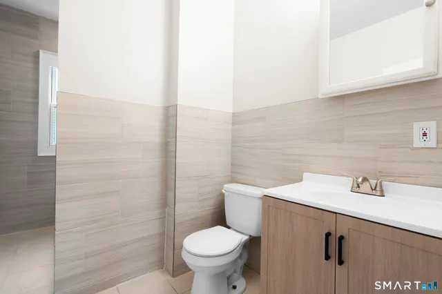 a bathroom with a toilet and a sink