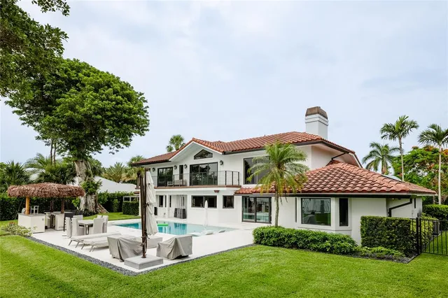 a front view of a building with a garden