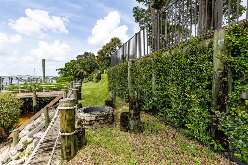 9 North River Road Stuart, FL 34996 - Photo 14 of 75 a view of a garden with an outdoor seating