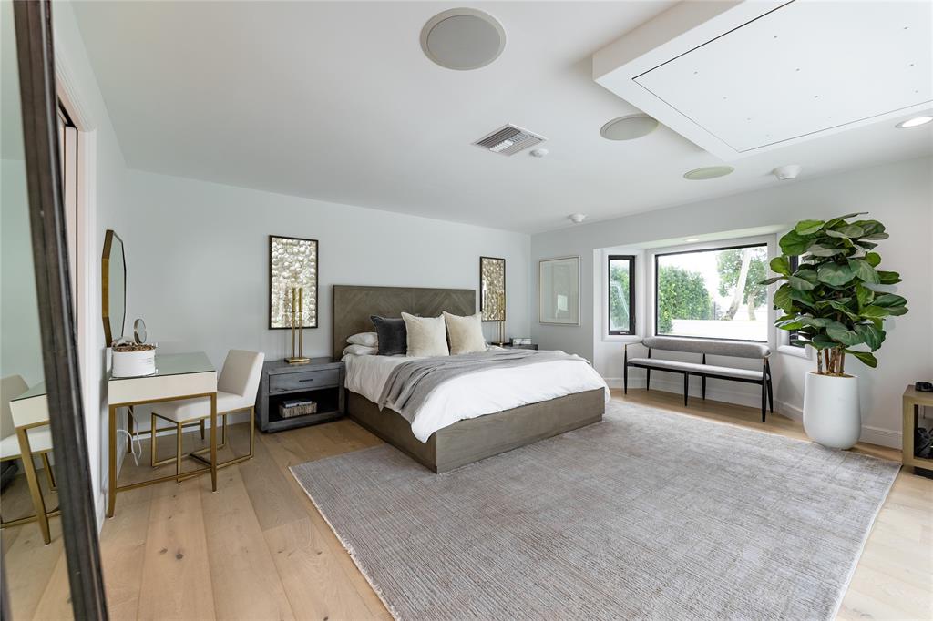 9 North River Road Stuart, FL 34996 - Photo 27 of 75 a bedroom with a bed and a couch