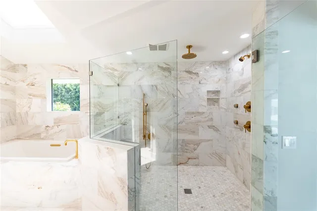 a living room with lots of furniture and a ceiling fan