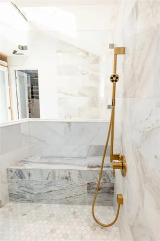 a spacious bedroom with a large bed and a large window