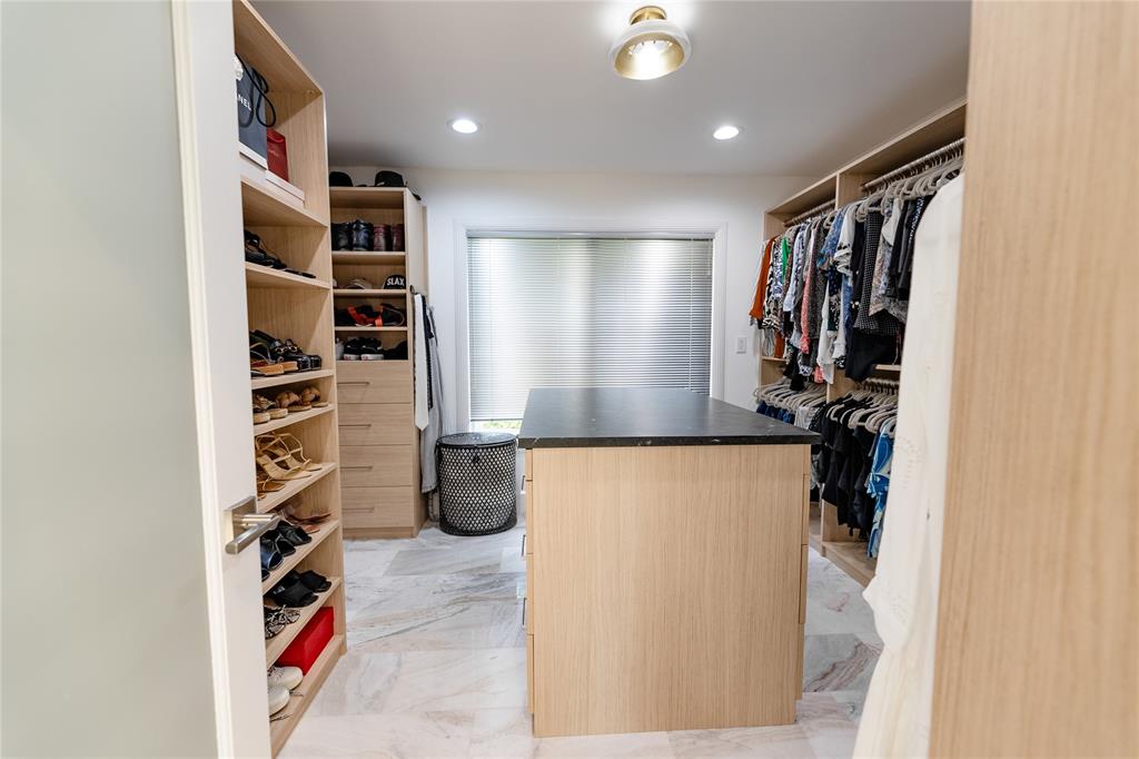 9 North River Road Stuart, FL 34996 - Photo 36 of 75 a view of walk in closet with clothes and shoes