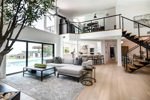 a bathroom with a granite countertop sink a bathtub and a shower