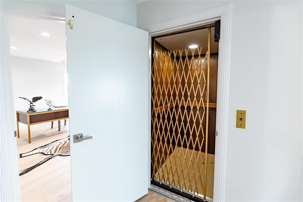 9 North River Road Stuart, FL 34996 - Photo 57 of 75 a view of a hallway with wooden floor and a bathroom