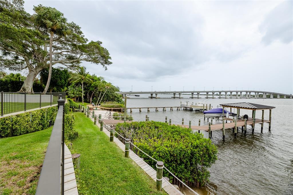 9 North River Road Stuart, FL 34996 - Photo 7 of 75 a view of a chairs and table on the wooden deck