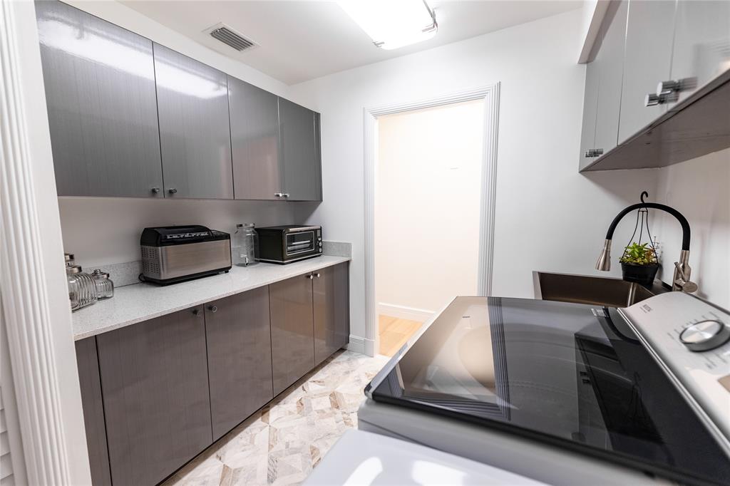 9 North River Road Stuart, FL 34996 - Photo 72 of 75 a kitchen with a stove and a cabinet