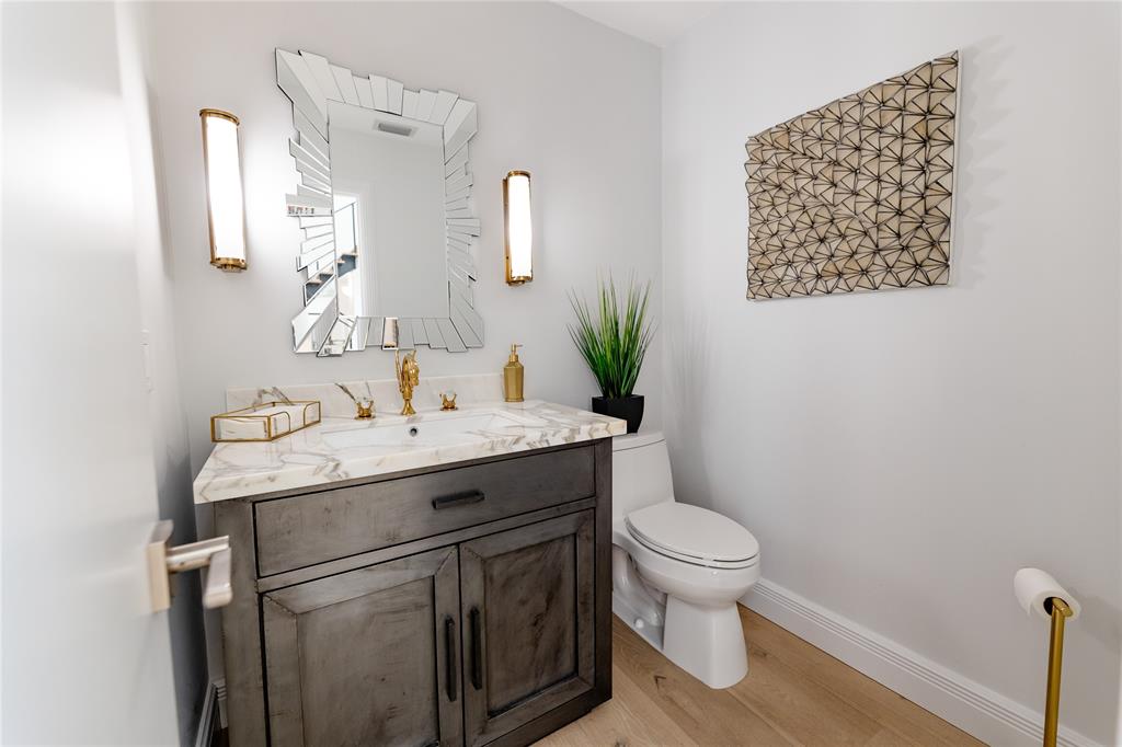 9 North River Road Stuart, FL 34996 - Photo 73 of 75 a bathroom with a granite countertop sink toilet and a mirror