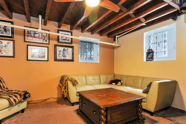 a view of house with a yard and furniture