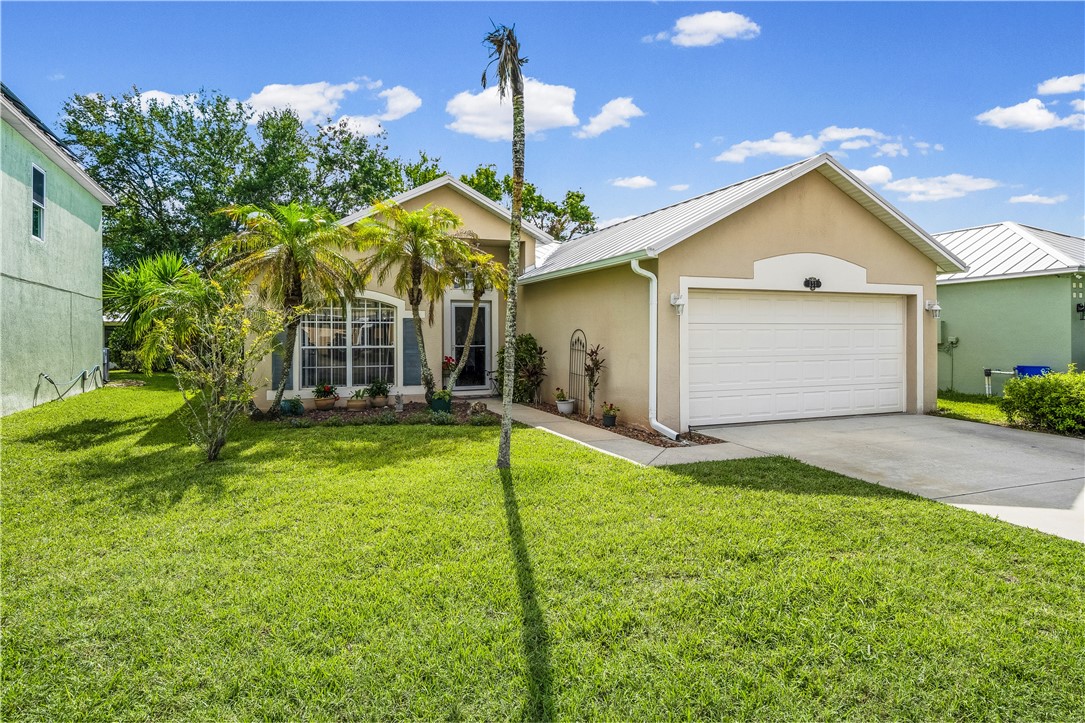 131 Bellamy Trail Sebastian, FL 32958 - Photo 2 of 32 a view of outdoor space yard and garage