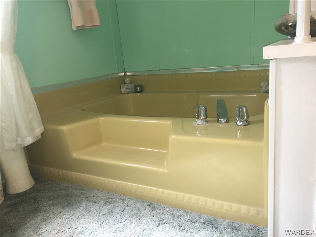 1745 Talc Road Bullhead City, AZ 86442 - Photo 16 of 31 a bathroom with a bathtub