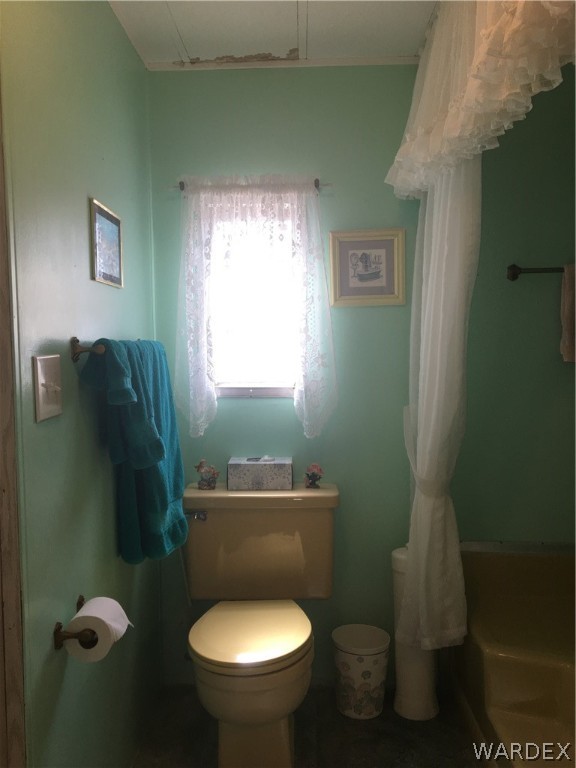 1745 Talc Road Bullhead City, AZ 86442 - Photo 17 of 31 a bathroom with a toilet sink and window