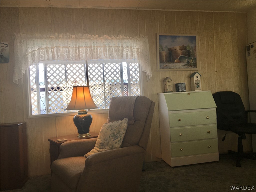 1745 Talc Road Bullhead City, AZ 86442 - Photo 2 of 31 a living room with furniture and a window