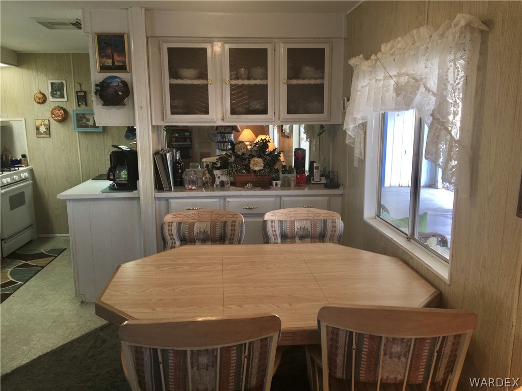 1745 Talc Road Bullhead City, AZ 86442 - Photo 3 of 31 a view of a room that has a bed and a table in it