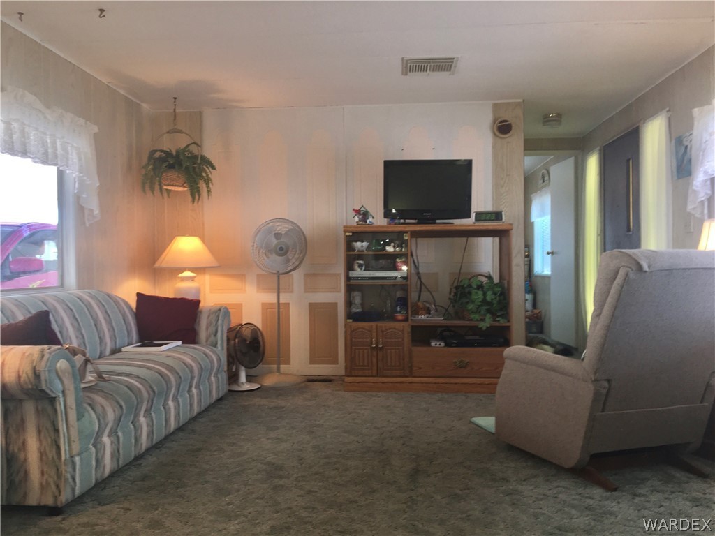 1745 Talc Road Bullhead City, AZ 86442 - Photo 4 of 31 a living room with furniture and a flat screen tv