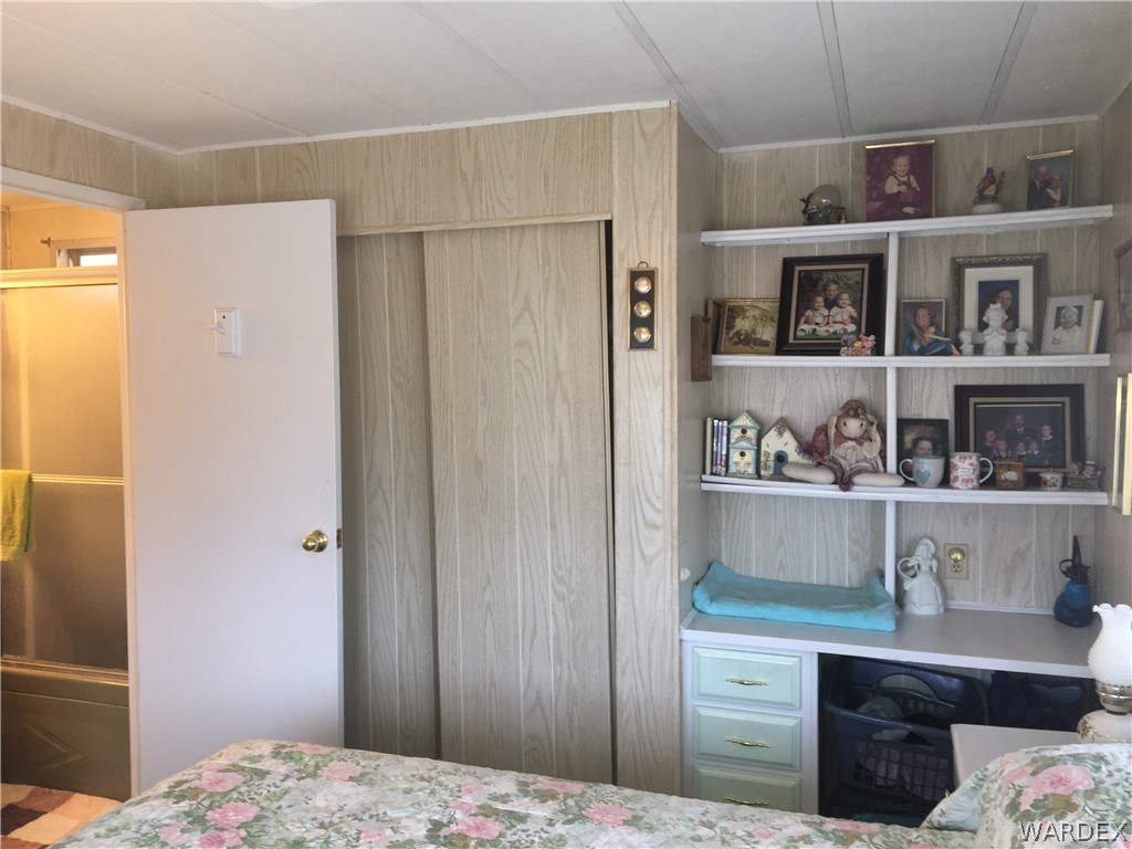 1745 Talc Road Bullhead City, AZ 86442 - Photo 8 of 31 a bedroom with a bed and closet