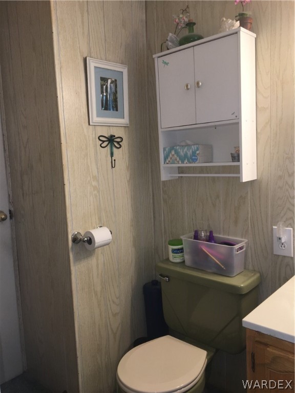 1745 Talc Road Bullhead City, AZ 86442 - Photo 9 of 31 a bathroom with a toilet and a mirror