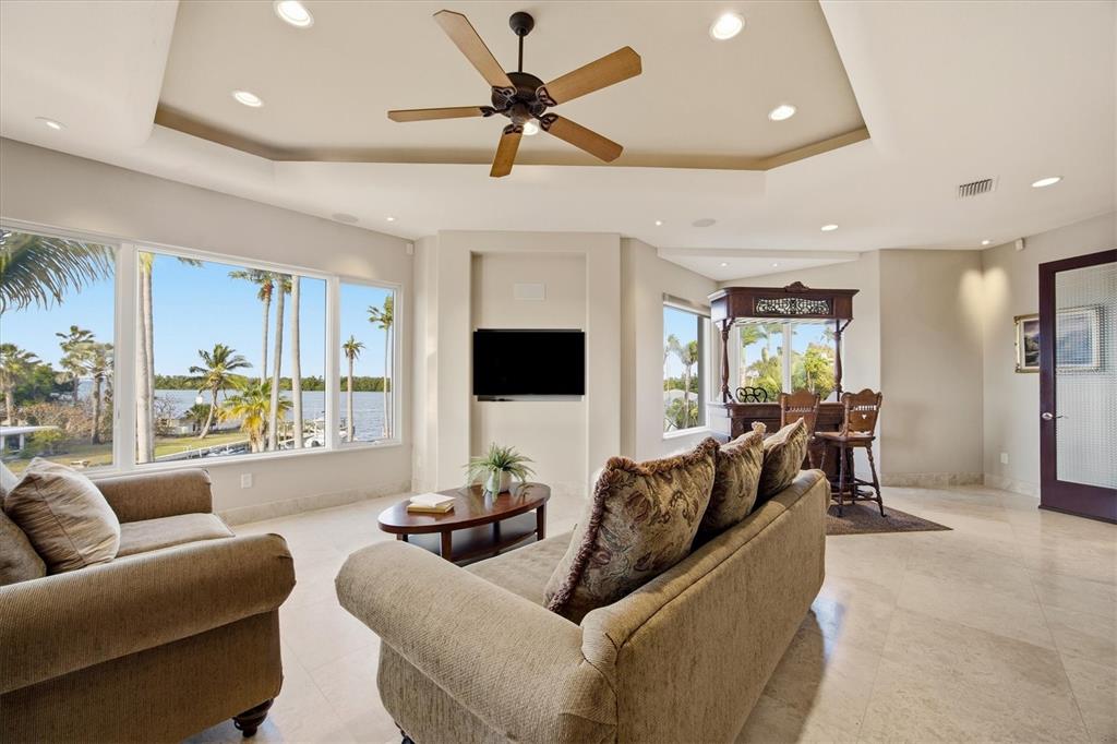 761 Norton Street Longboat Key, FL 34228 - Photo 34 of 66 a living room with furniture and a flat screen tv