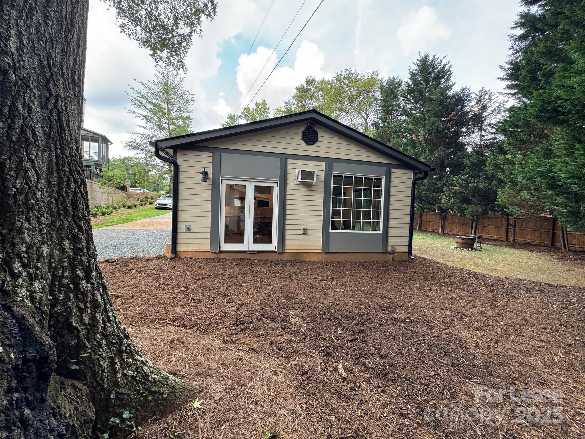 716 East Woodlawn Road Charlotte, NC 28209 - Photo 2 of 17 a view of a house with a yard and large tree