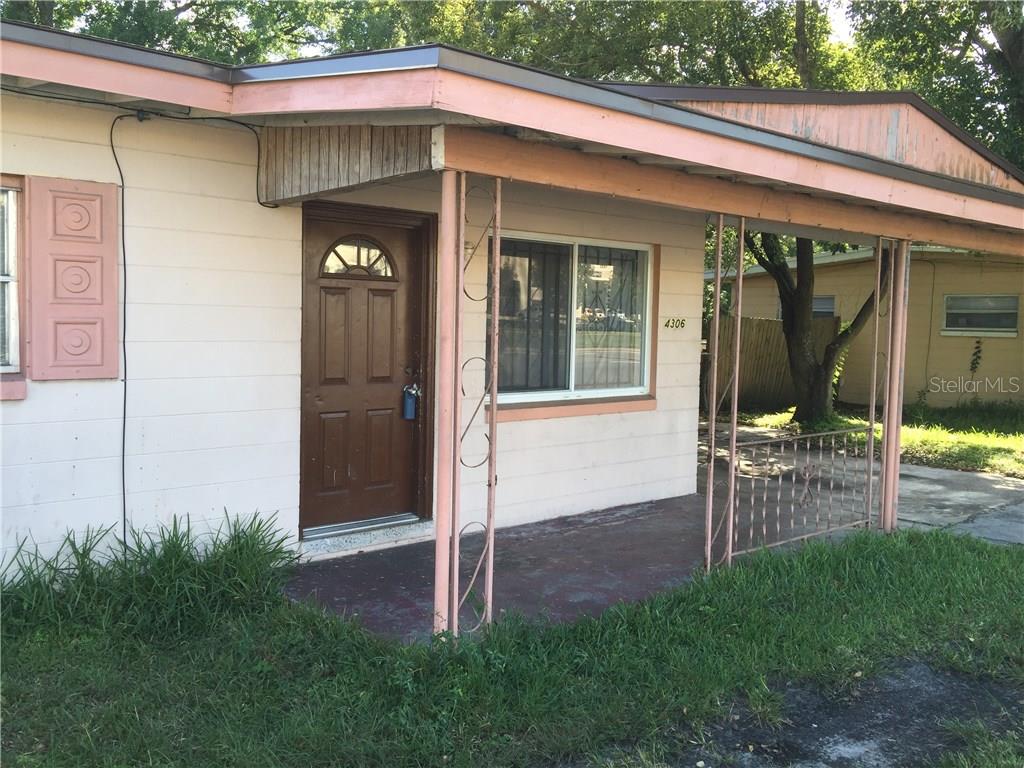 4306 Silver Star Road Orlando, FL 32808 - Photo 1 of 1 a front view of a house with porch