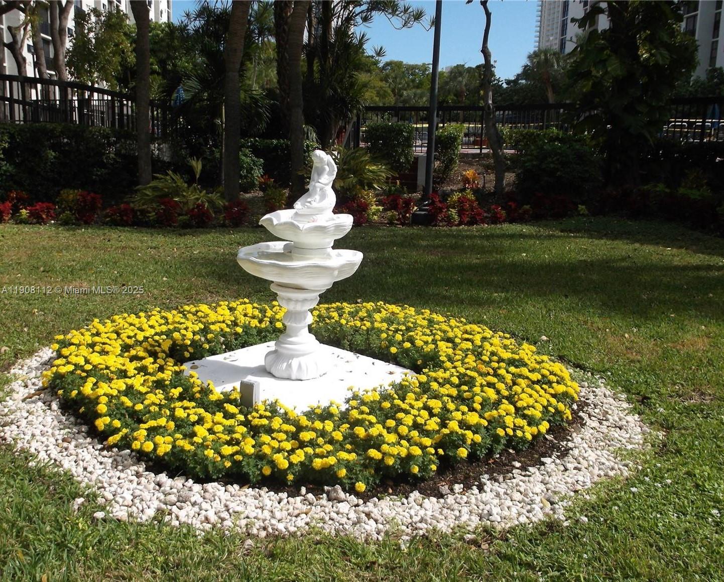 16909 North Bay Road, Unit 103 Sunny Isles Beach, FL 33160 - Photo 35 of 35 a view of a garden with a fountain