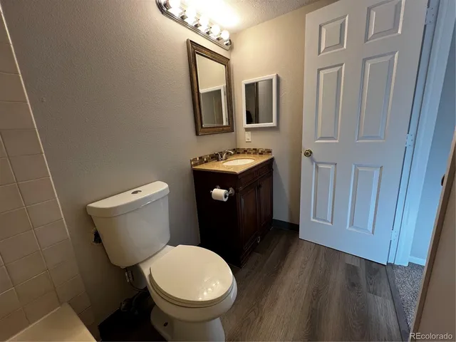 a bathroom with a toilet and a sink