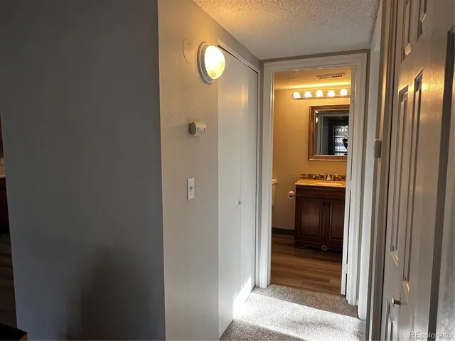 a view of a bathroom from a hallway