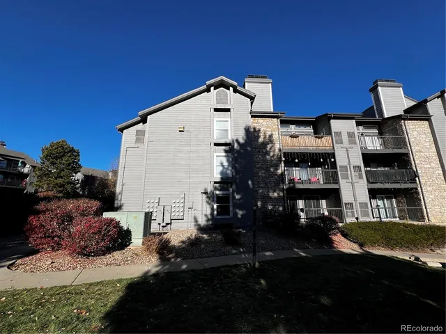 a front view of a house with many windows
