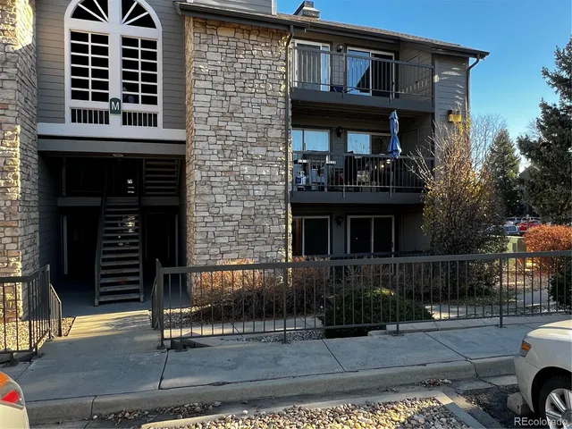 a front view of a house with parking space
