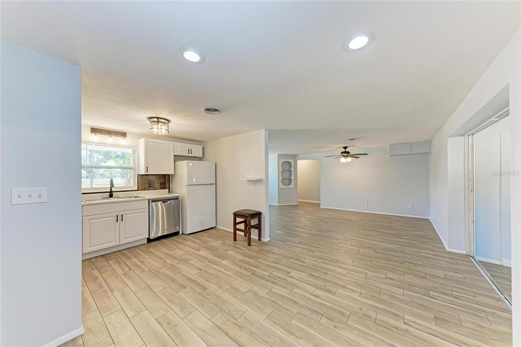 4010 South Lockwood Ridge Road Sarasota, FL 34231 - Photo 13 of 48 a large white kitchen with cabinets