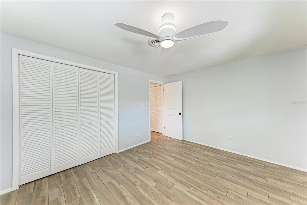 4010 South Lockwood Ridge Road Sarasota, FL 34231 - Photo 22 of 48 wooden floor in an empty room