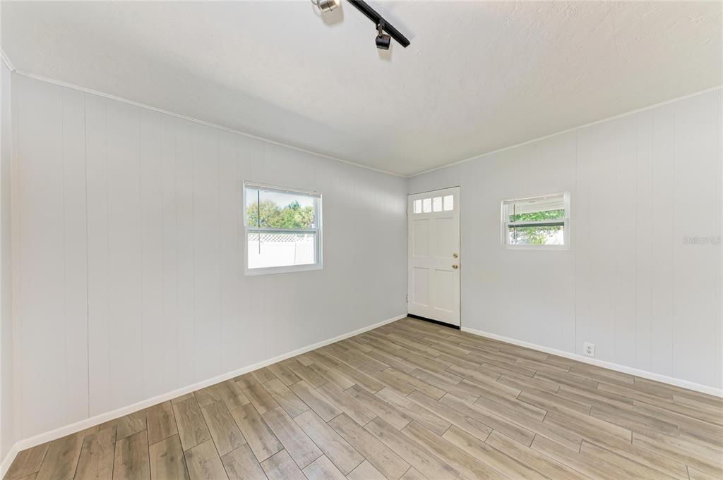 4010 South Lockwood Ridge Road Sarasota, FL 34231 - Photo 28 of 48 an empty room with windows