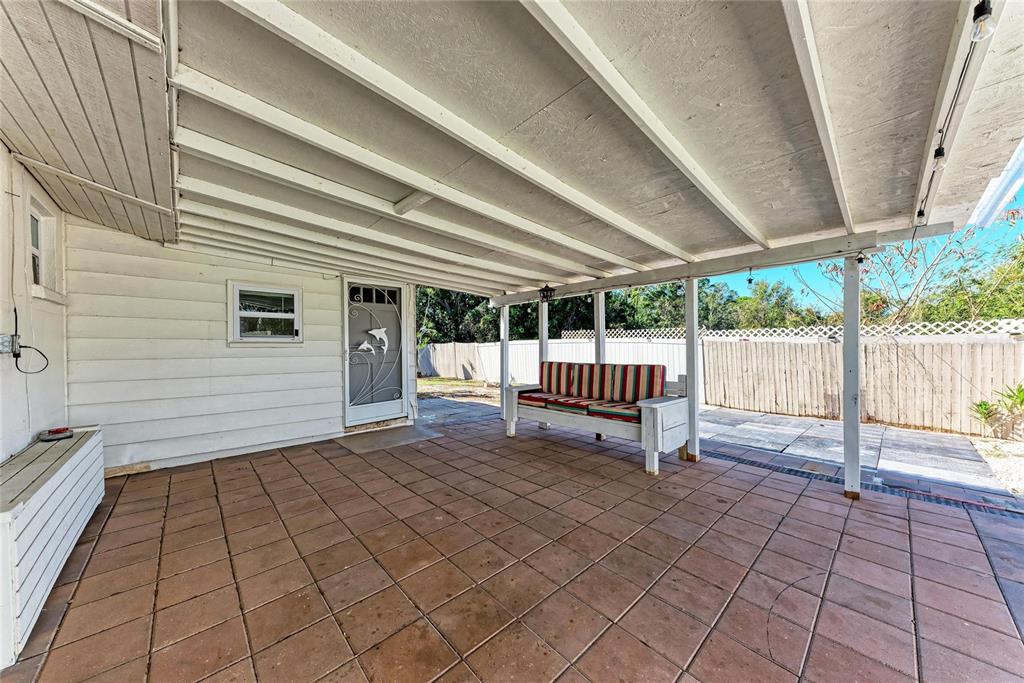 4010 South Lockwood Ridge Road Sarasota, FL 34231 - Photo 31 of 48 a view of a backyard with a large tree