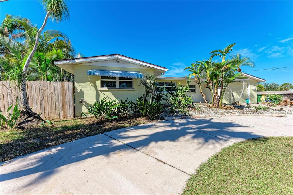 4010 South Lockwood Ridge Road Sarasota, FL 34231 - Photo 39 of 48 a front view of a house with a yard